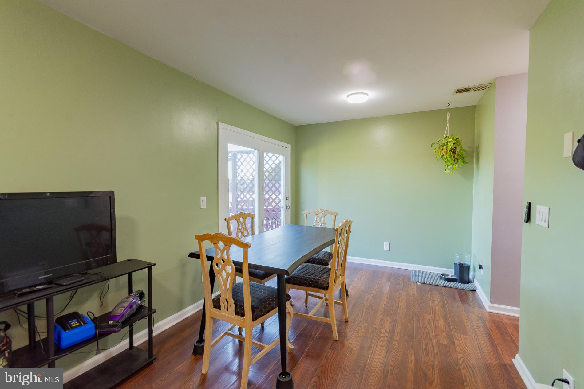 306 East 12th Avenue, Unit B Ranson, WV 25438 - Photo 8 of 31 a view of a livingroom with furniture and a flat screen tv