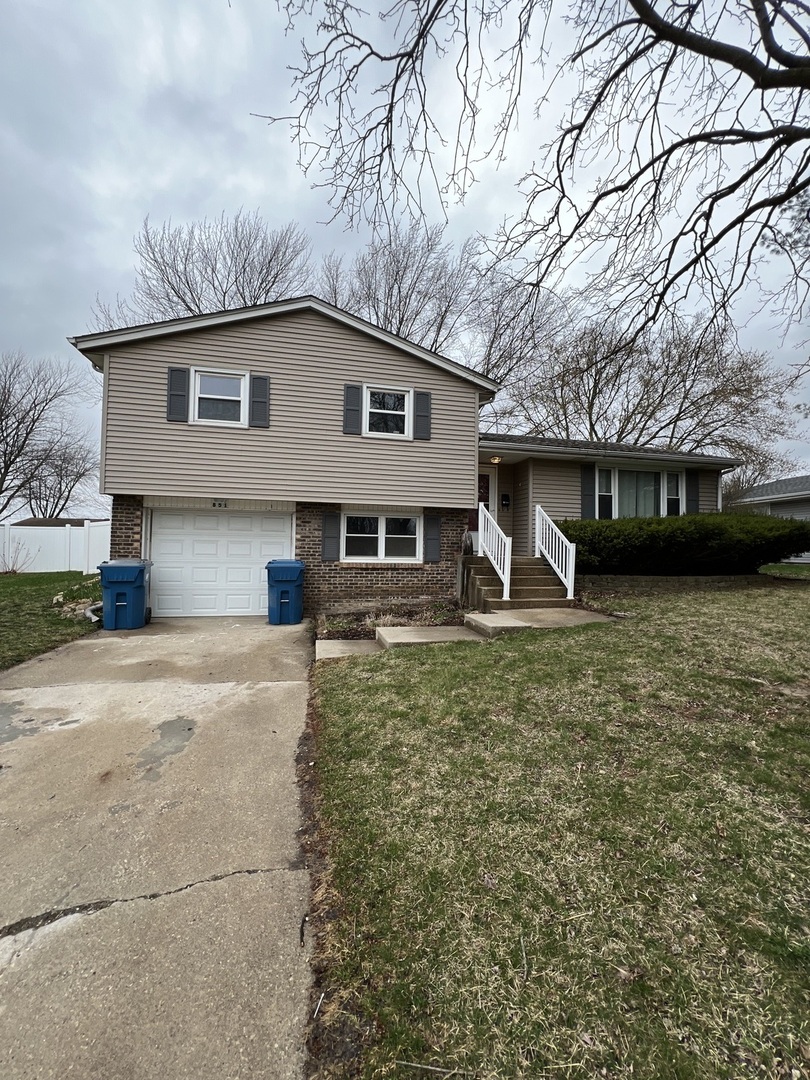 851 Robert Drive Bourbonnais, IL 60914 - Photo 1 of 1 a front view of a house with garden