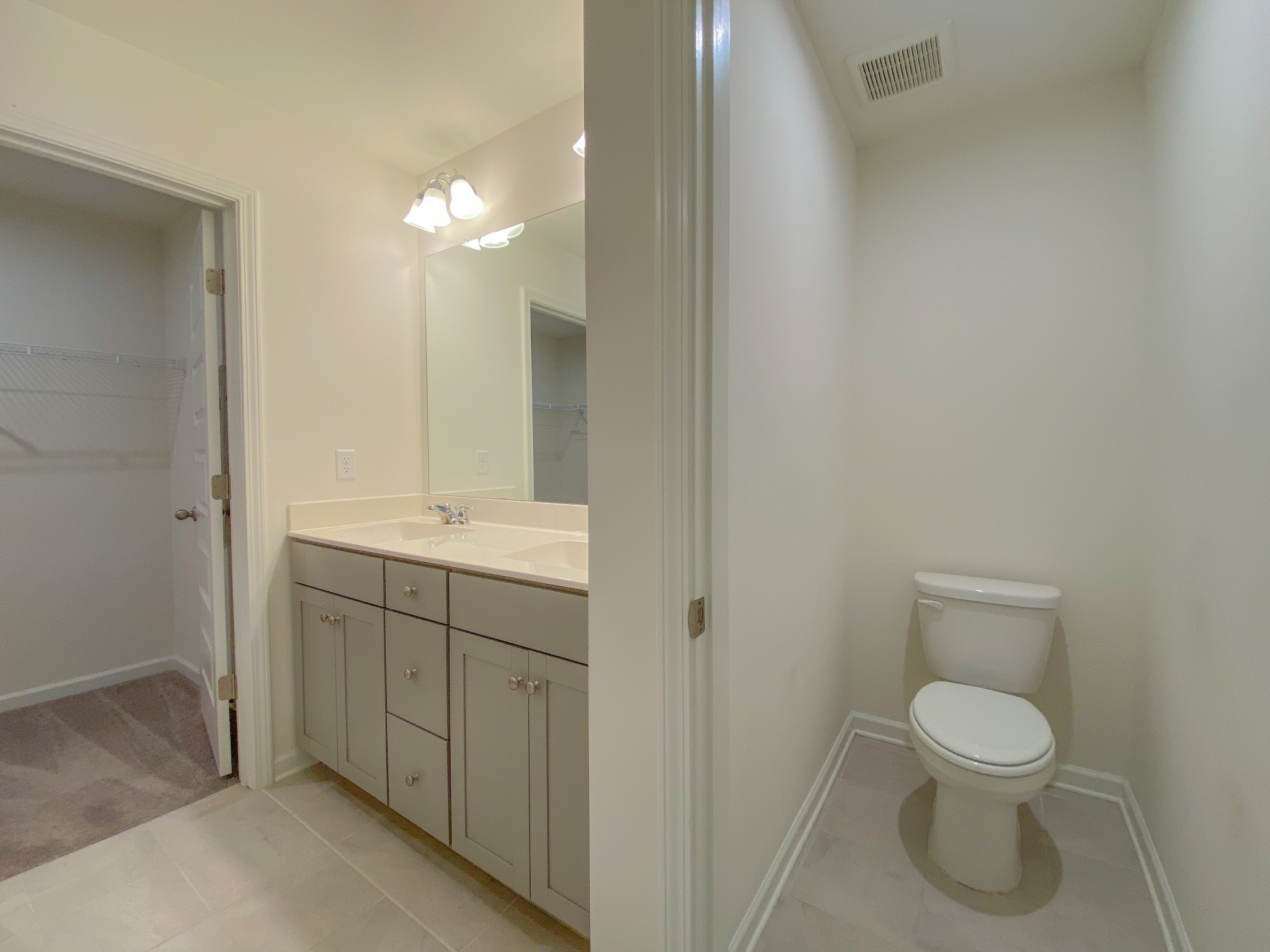 3315 Deerchase Circle Murfreesboro, TN 37129 - Photo 13 of 37 a bathroom with a toilet a sink and mirror