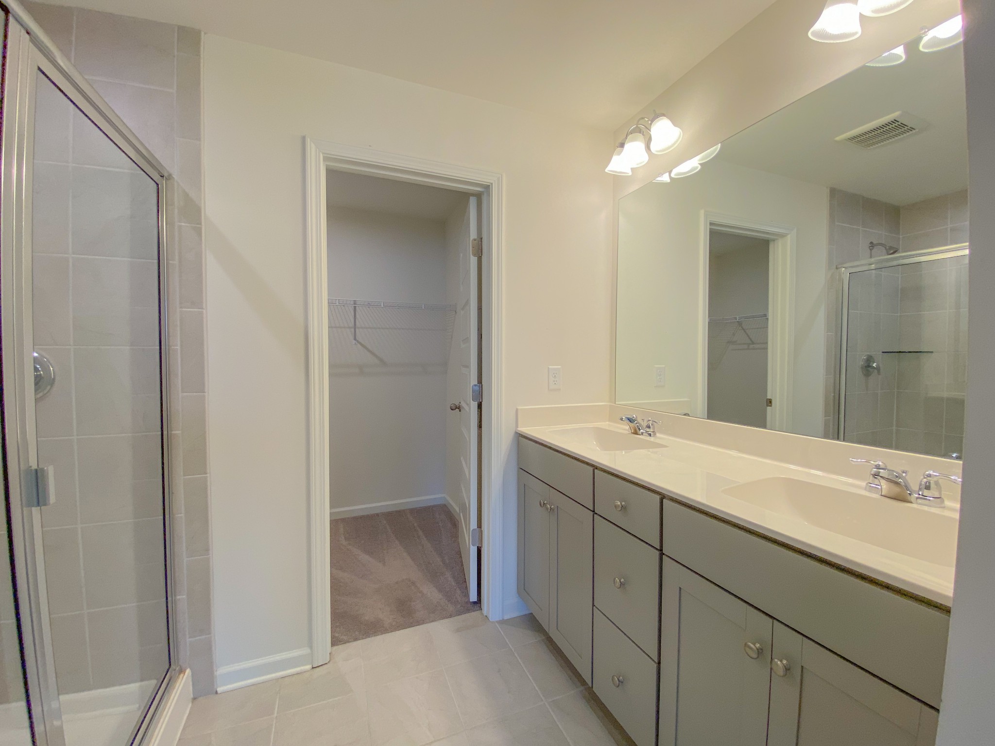 3315 Deerchase Circle Murfreesboro, TN 37129 - Photo 17 of 37 a bathroom with a double vanity sink and a mirror
