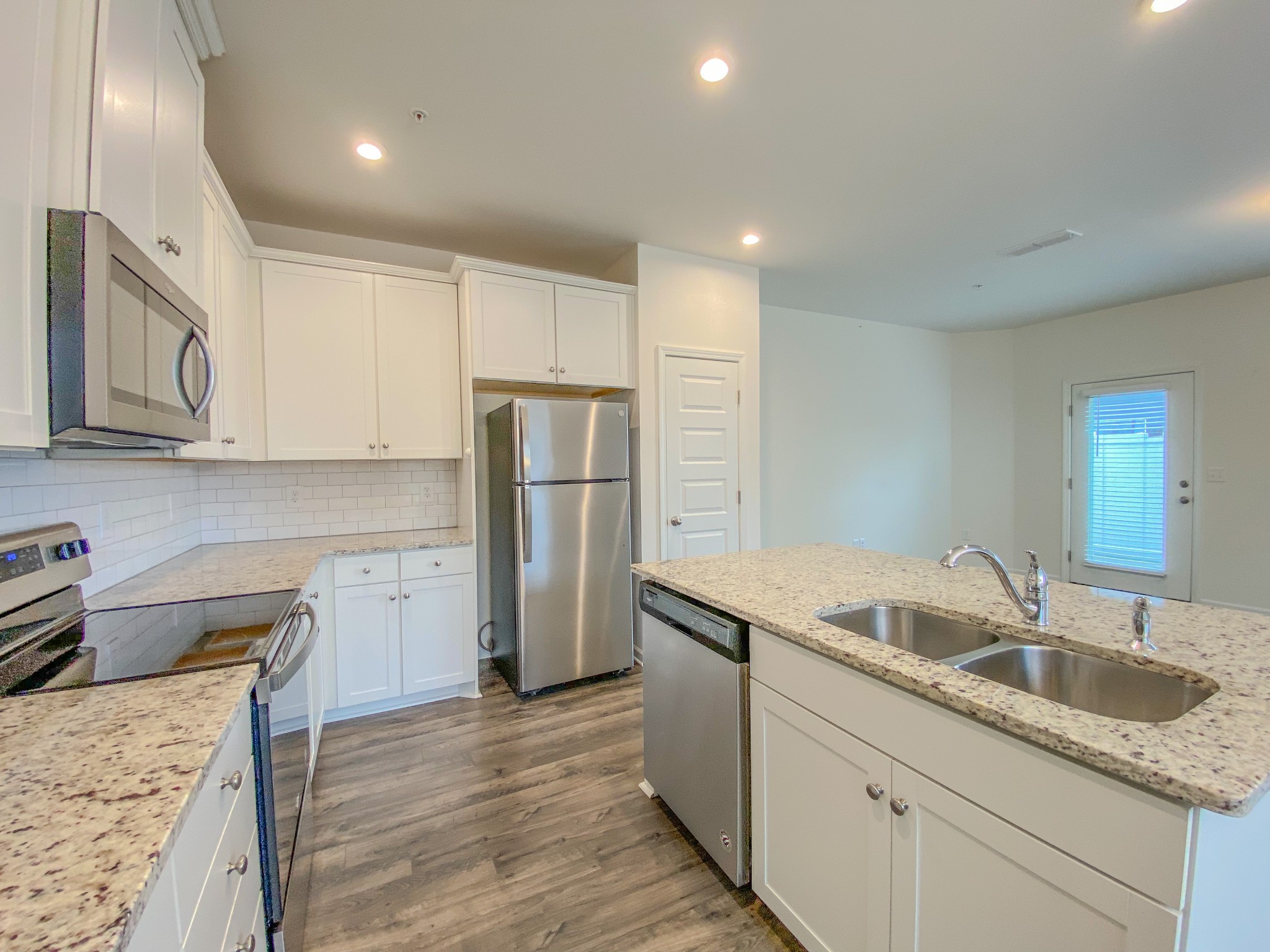 3315 Deerchase Circle Murfreesboro, TN 37129 - Photo 5 of 37 a kitchen that has a sink a refrigerator and a stove top oven