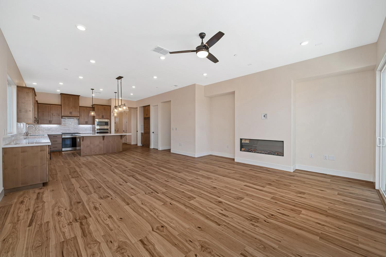 3922 Buxus Road Rocklin, CA 95765 - Photo 6 of 11 a view of kitchen and empty room with wooden floor