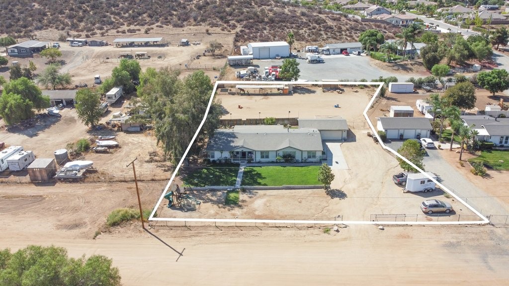 26083 Okuma Road Menifee, CA 92584 - Photo 1 of 1 an aerial view of a house with a yard