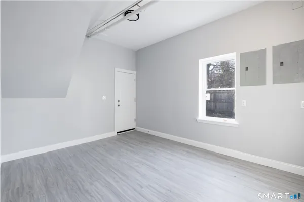 a view of an empty room with a fireplace