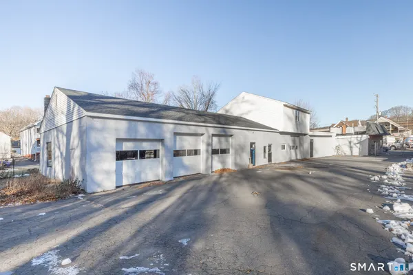 a view of a big house with a big yard