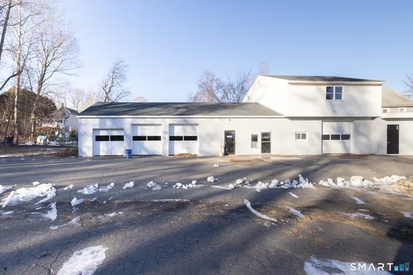 a view of road with large trees