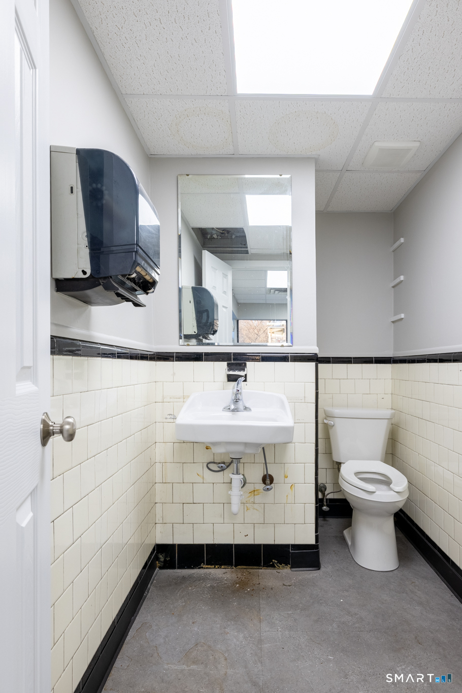 159 Park Street Bristol, CT 06010 - Photo 22 of 39 a bathroom with a sink toilet a mirror and vanity