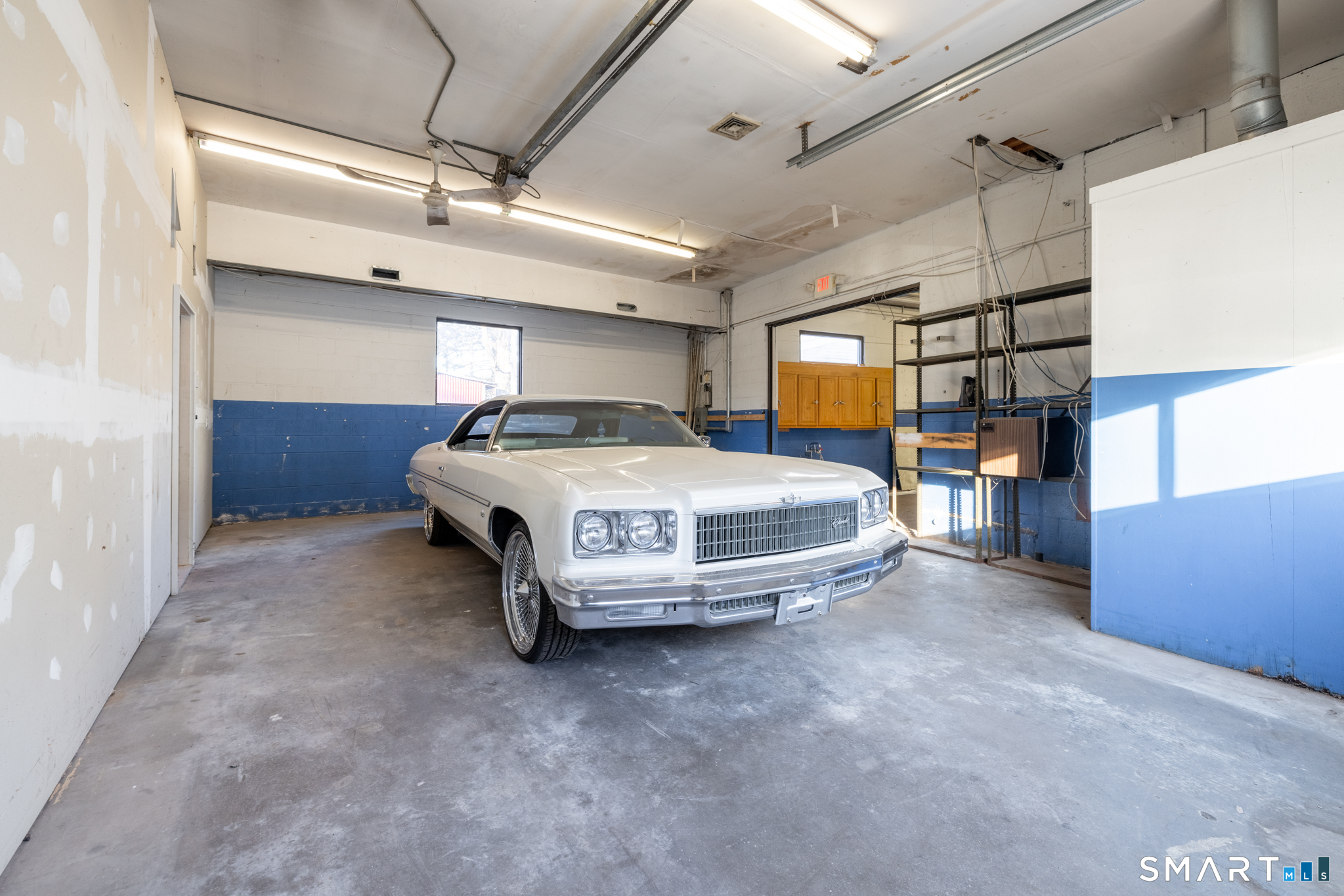 159 Park Street Bristol, CT 06010 - Photo 28 of 39 a car parked in a garage
