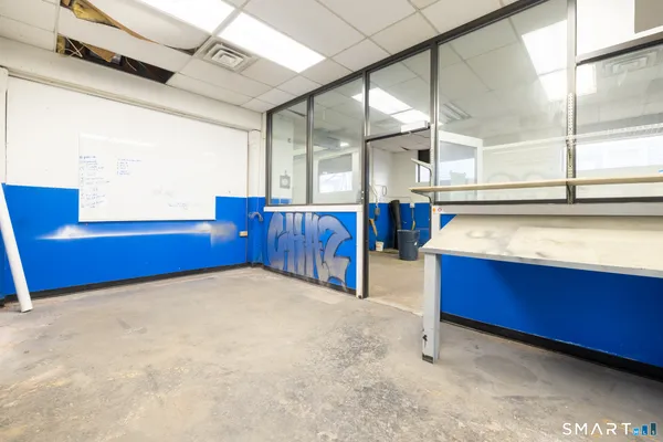 a view of an empty room with windows