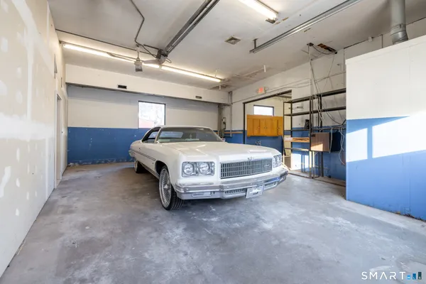 a bathroom with a sink toilet a mirror and shower