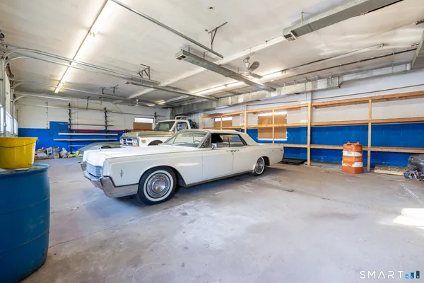 a view of parking garage with cars