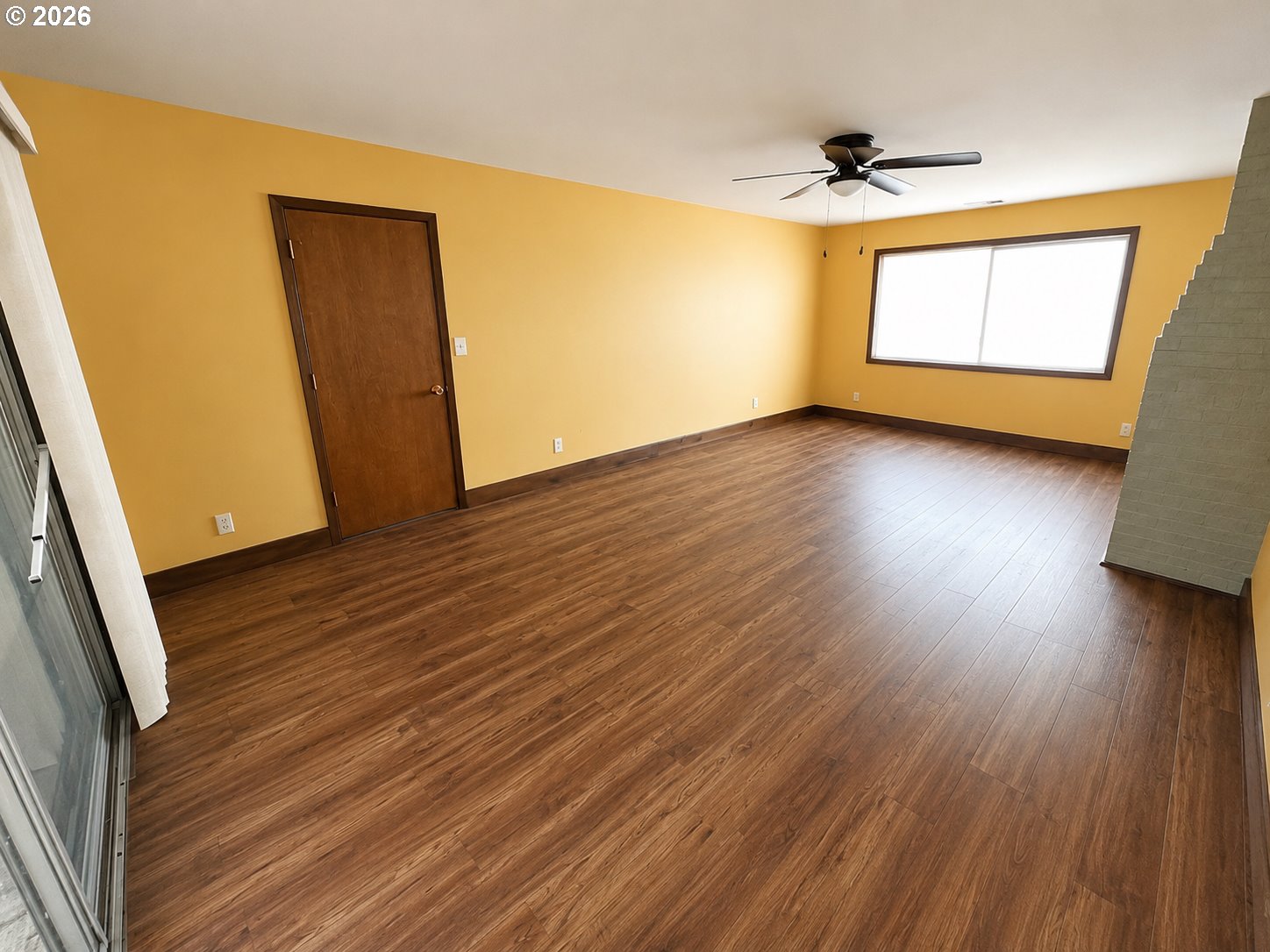 10 Southwest Peach Lane Winston, OR 97496 - Photo 16 of 22 a view of empty room with wooden floor and fan