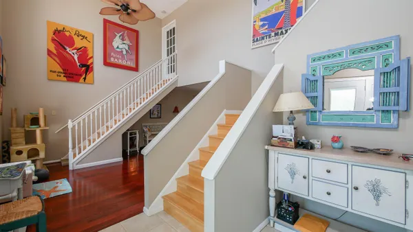a view of hallway with window and workspace