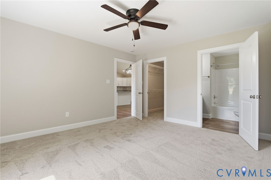 17557 Hewlett Road Beaverdam, VA 23015 - Photo 22 of 29 an empty room with closet and a ceiling fan