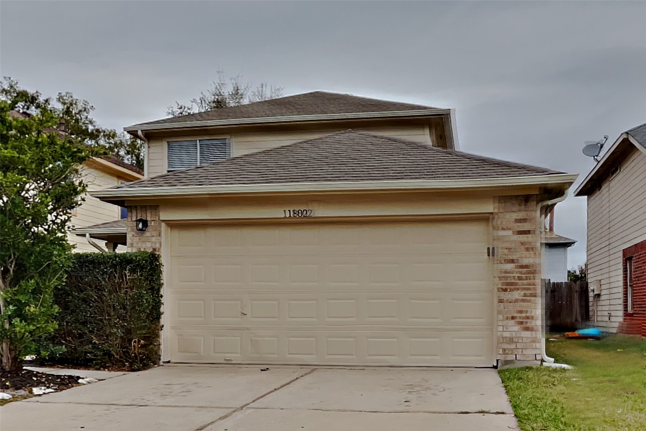 11802 Rolling Stream Drive Tomball, TX 77375 - Photo 1 of 19 a front view of a house with a garden