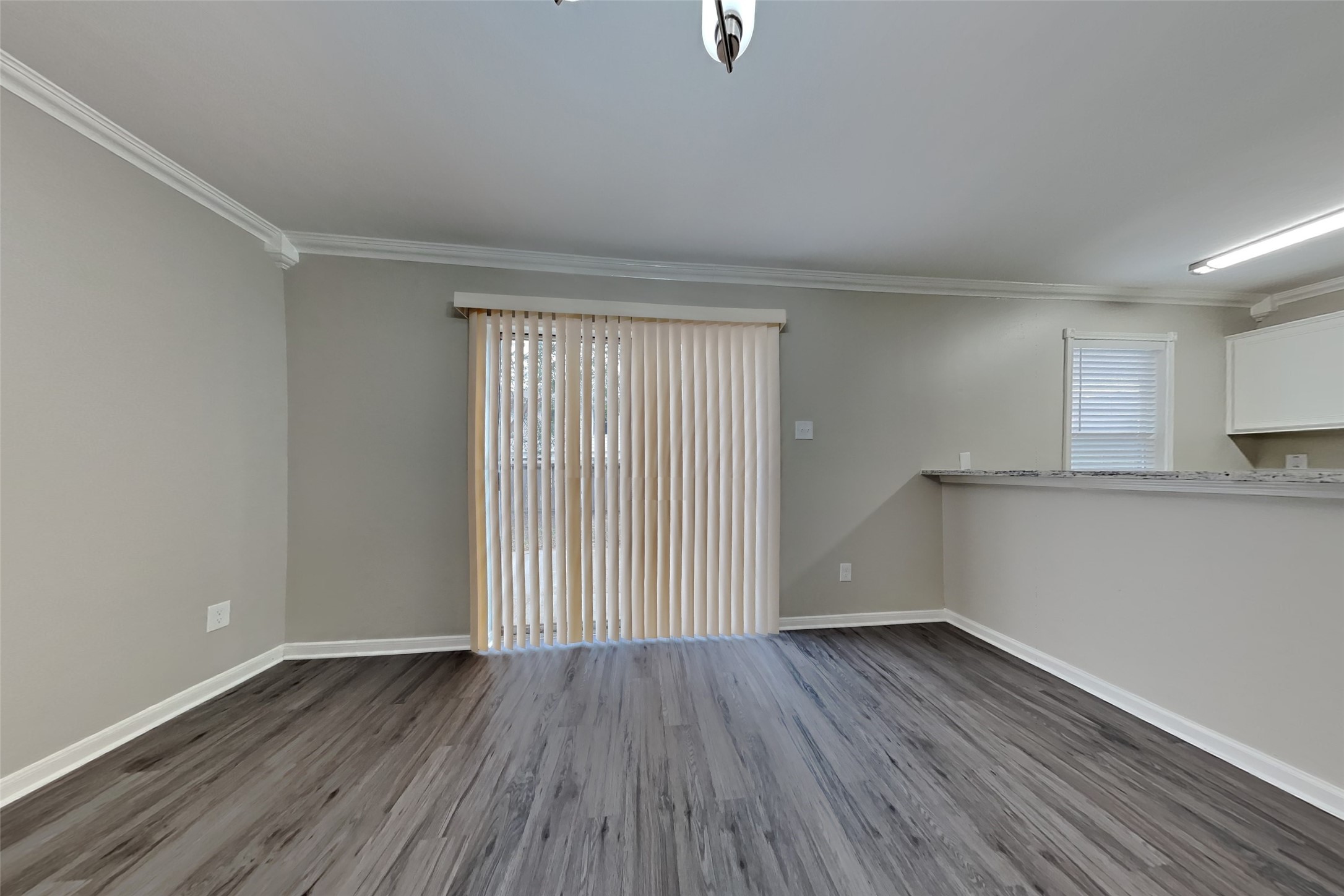 11802 Rolling Stream Drive Tomball, TX 77375 - Photo 7 of 19 an empty room with wooden floor and windows