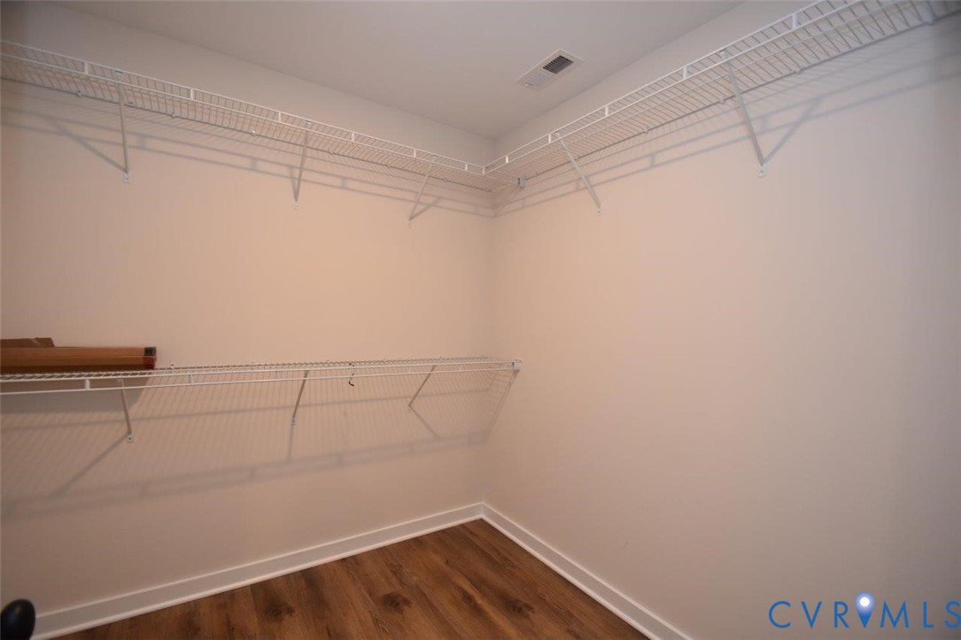1749 Hollands Road Palmyra, VA 22963 - Photo 27 of 40 Walk in closet featuring dark wood finished floors