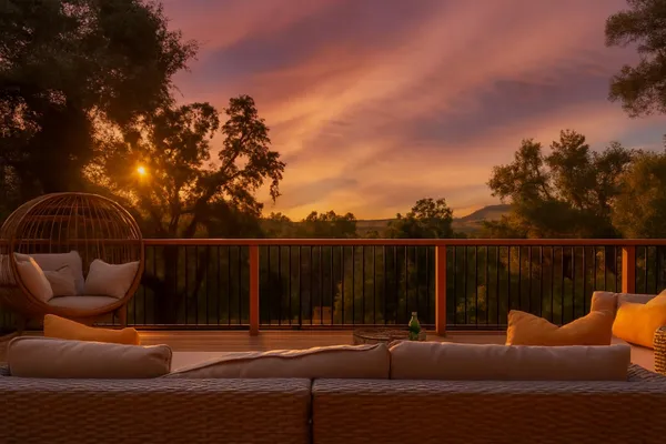 a terrace with outdoor seating and city view