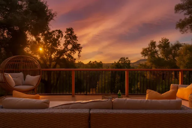 a terrace with outdoor seating and city view