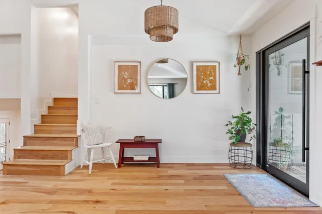 a view of an entryway with wooden floor