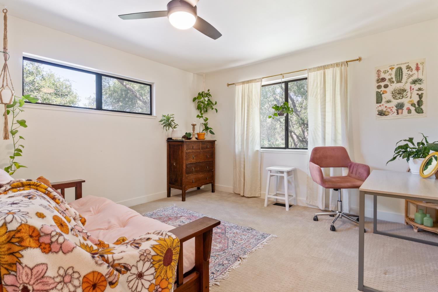 1228 Wingdam Road Murphys, CA 95247 - Photo 24 of 43 a bedroom with a bed and a chandelier