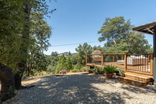 a view of a house with wooden fence