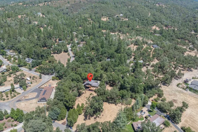an aerial view of a town with couple of houses