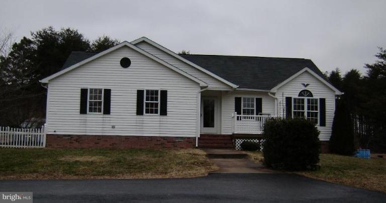 6024 Towles Mill Road Partlow, VA 22534 - Photo 1 of 11 a front view of a house with garden
