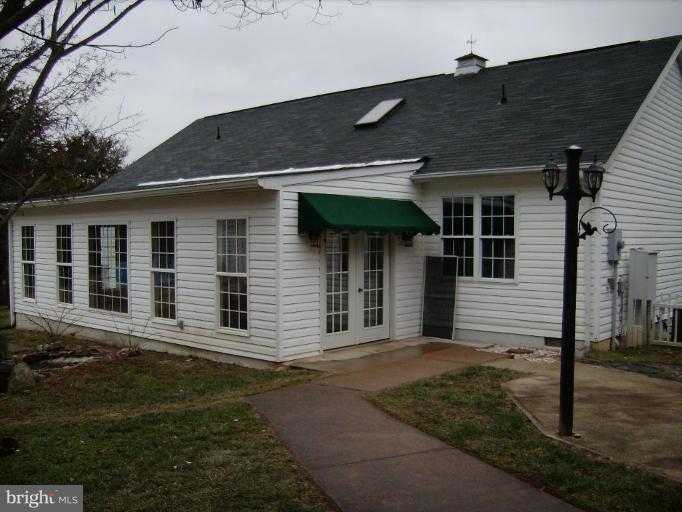6024 Towles Mill Road Partlow, VA 22534 - Photo 4 of 11 a front view of a house with a garden