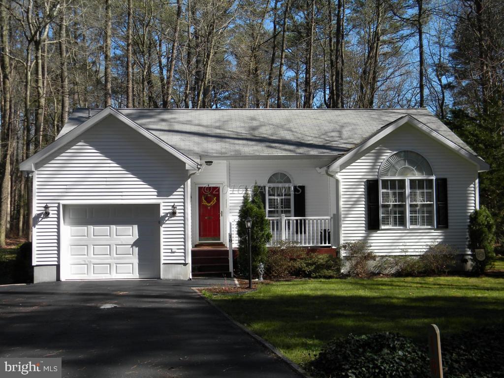 18 Falcon Bridge Road Ocean Pines, MD 21811 - Photo 1 of 21 a front view of a house with a garden
