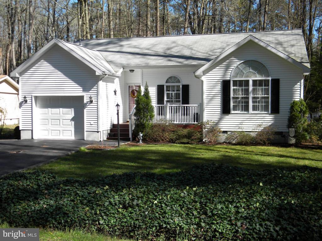 18 Falcon Bridge Road Ocean Pines, MD 21811 - Photo 2 of 21 a front view of a house with a yard