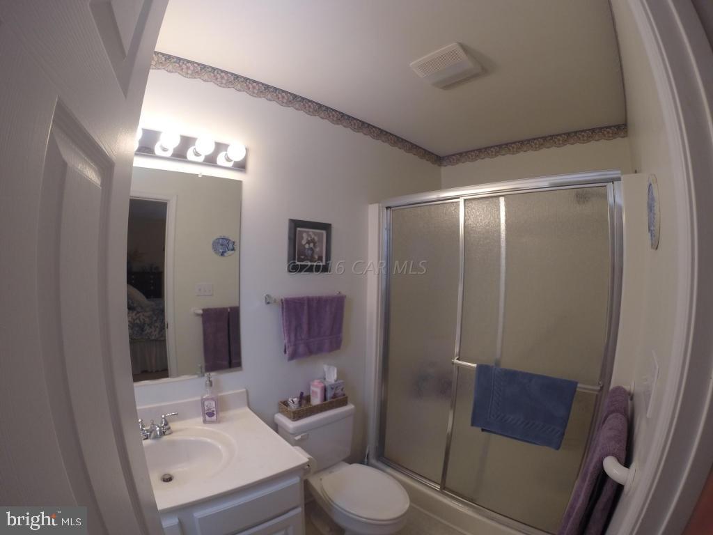 18 Falcon Bridge Road Ocean Pines, MD 21811 - Photo 12 of 21 a bathroom with a toilet sink and shower
