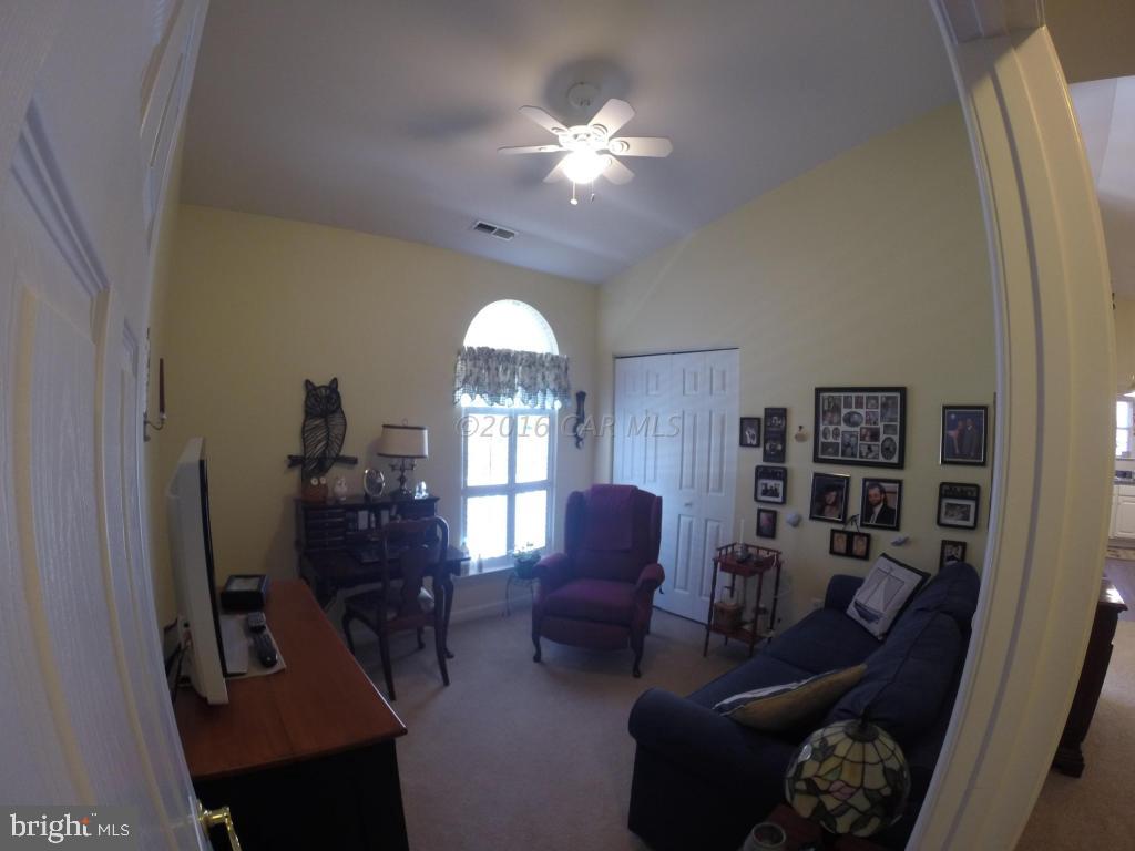 18 Falcon Bridge Road Ocean Pines, MD 21811 - Photo 13 of 21 a living room with furniture and a flat screen tv