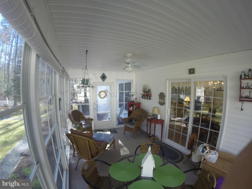 18 Falcon Bridge Road Ocean Pines, MD 21811 - Photo 15 of 21 a view of a dining room with furniture window and outside view