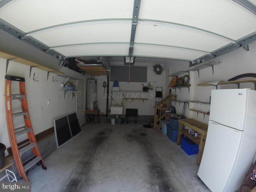 18 Falcon Bridge Road Ocean Pines, MD 21811 - Photo 21 of 21 a view of storage and utility room with a refrigerator