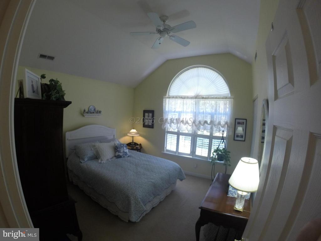 18 Falcon Bridge Road Ocean Pines, MD 21811 - Photo 7 of 21 a living room with furniture and a large window