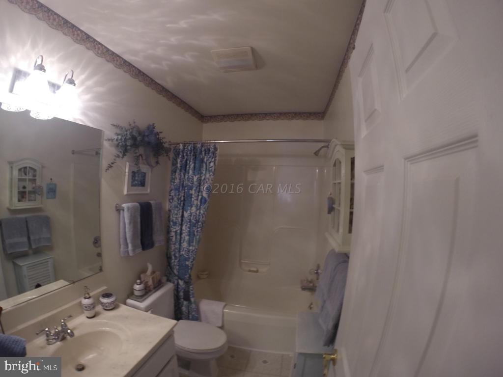 18 Falcon Bridge Road Ocean Pines, MD 21811 - Photo 9 of 21 a bathroom with a sink toilet and shower