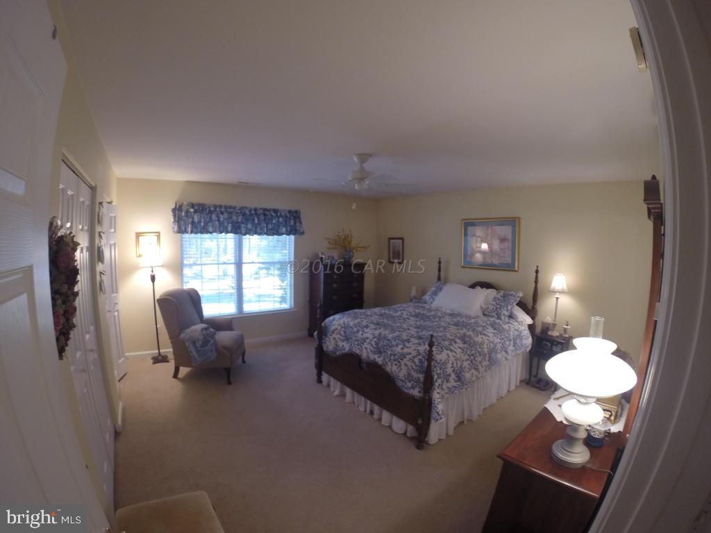 18 Falcon Bridge Road Ocean Pines, MD 21811 - Photo 10 of 21 a living room with furniture chandelier and a table