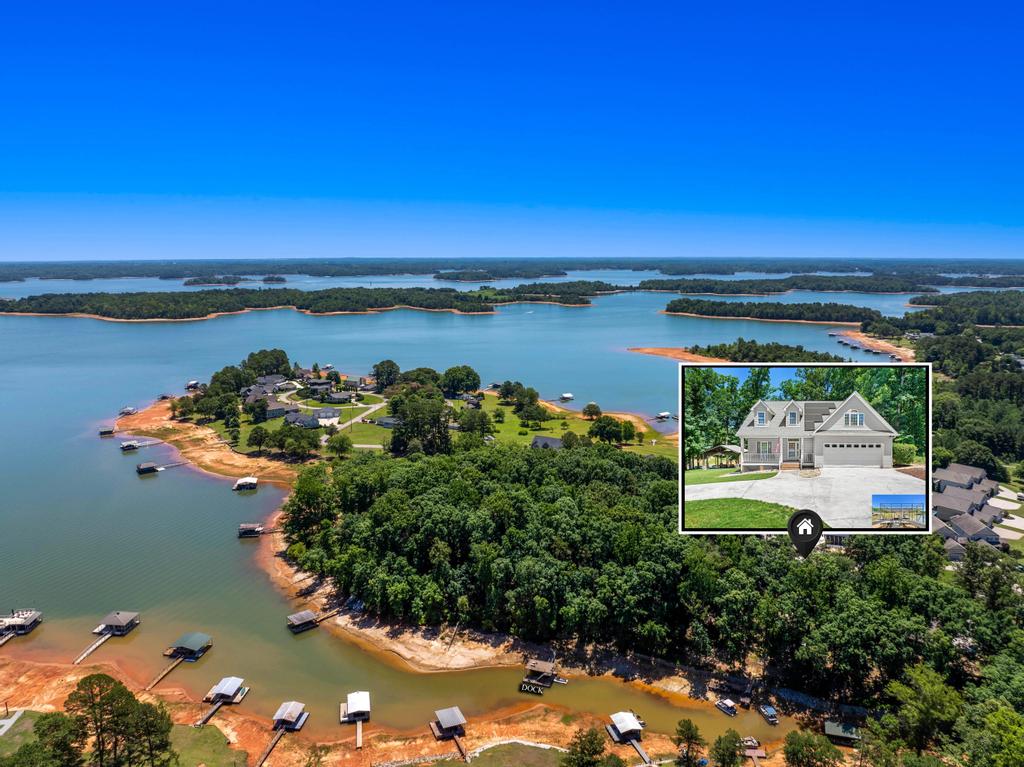 217 Maret Road Townville, SC 29689 - Photo 10 of 35 An aerial perspective reveals a serene lakefront community with private docks and lush green surroundings.