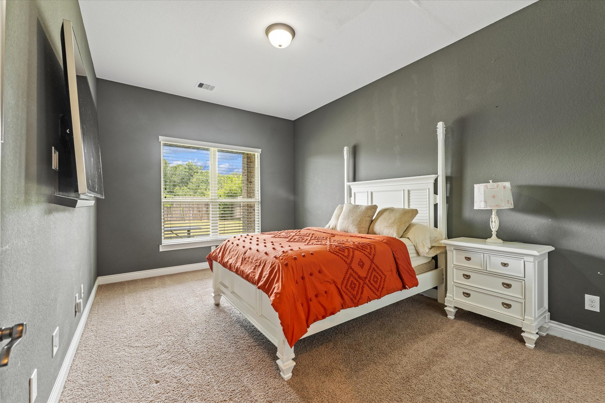 2506 Barclay Lake Lane Spring, TX 77388 - Photo 8 of 35 This room located on the first floor is spacious and elegant, where deep charcoal walls set a sophisticated backdrop for restful nights and quiet mornings. This flex room can be used as either a media room, play room, or 5th bedroom!