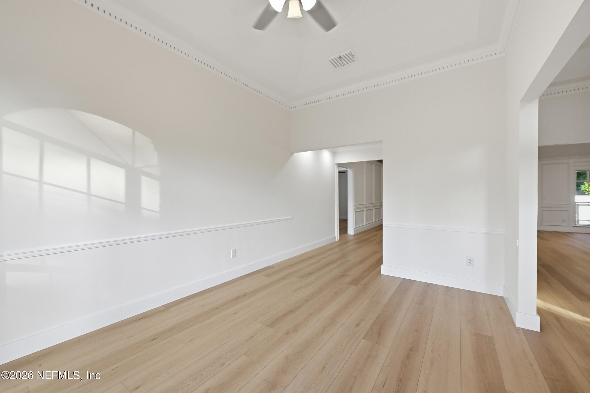 3286 Marbon Road Jacksonville, FL 32223 - Photo 11 of 36 wooden floor in an empty room with a window
