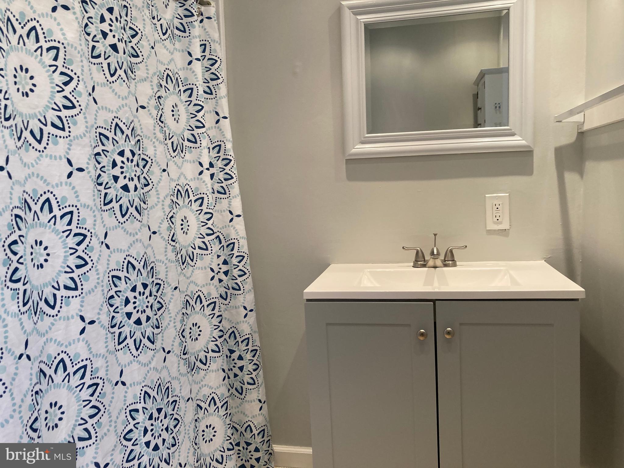 3449 B Street Philadelphia, PA 19134 - Photo 12 of 17 a bathroom with a sink and a mirror