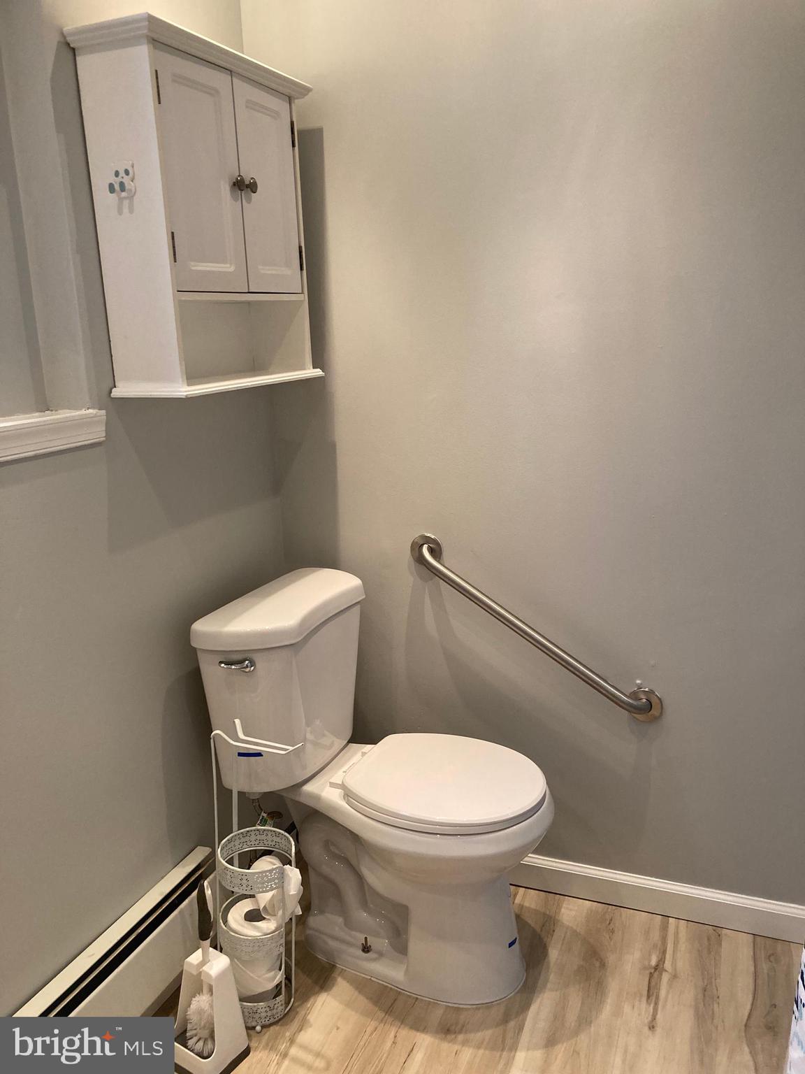 3449 B Street Philadelphia, PA 19134 - Photo 13 of 17 a white toilet sitting next to a bathroom sink