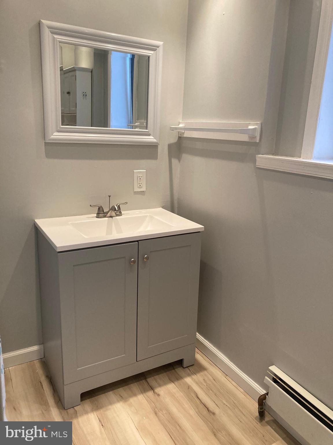 3449 B Street Philadelphia, PA 19134 - Photo 14 of 17 a bathroom with a sink and a mirror
