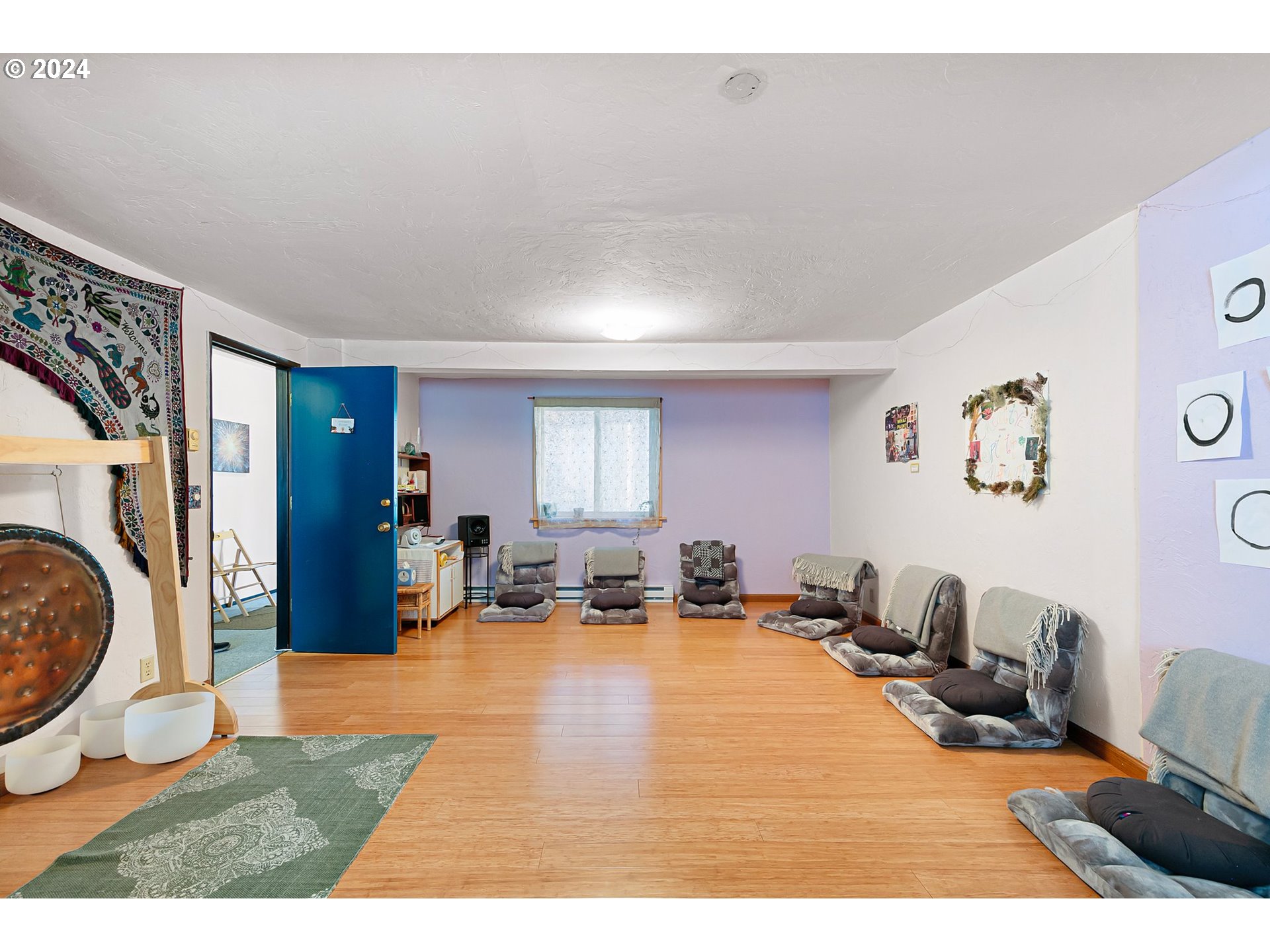 739 West 5th Avenue Eugene, OR 97402 - Photo 13 of 31 a living room with furniture a rug and a large window