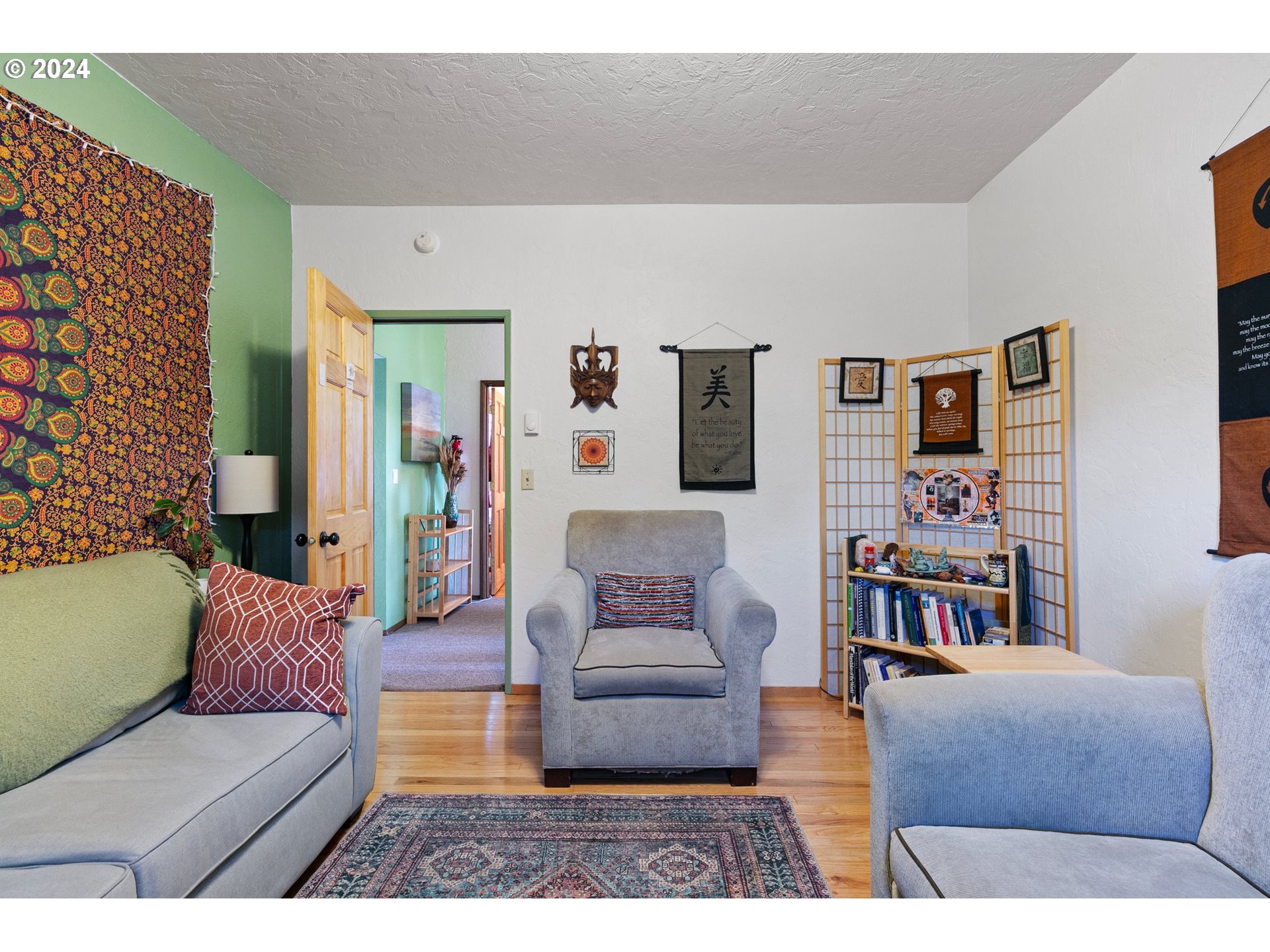 739 West 5th Avenue Eugene, OR 97402 - Photo 21 of 31 a living room with furniture and a book shelf