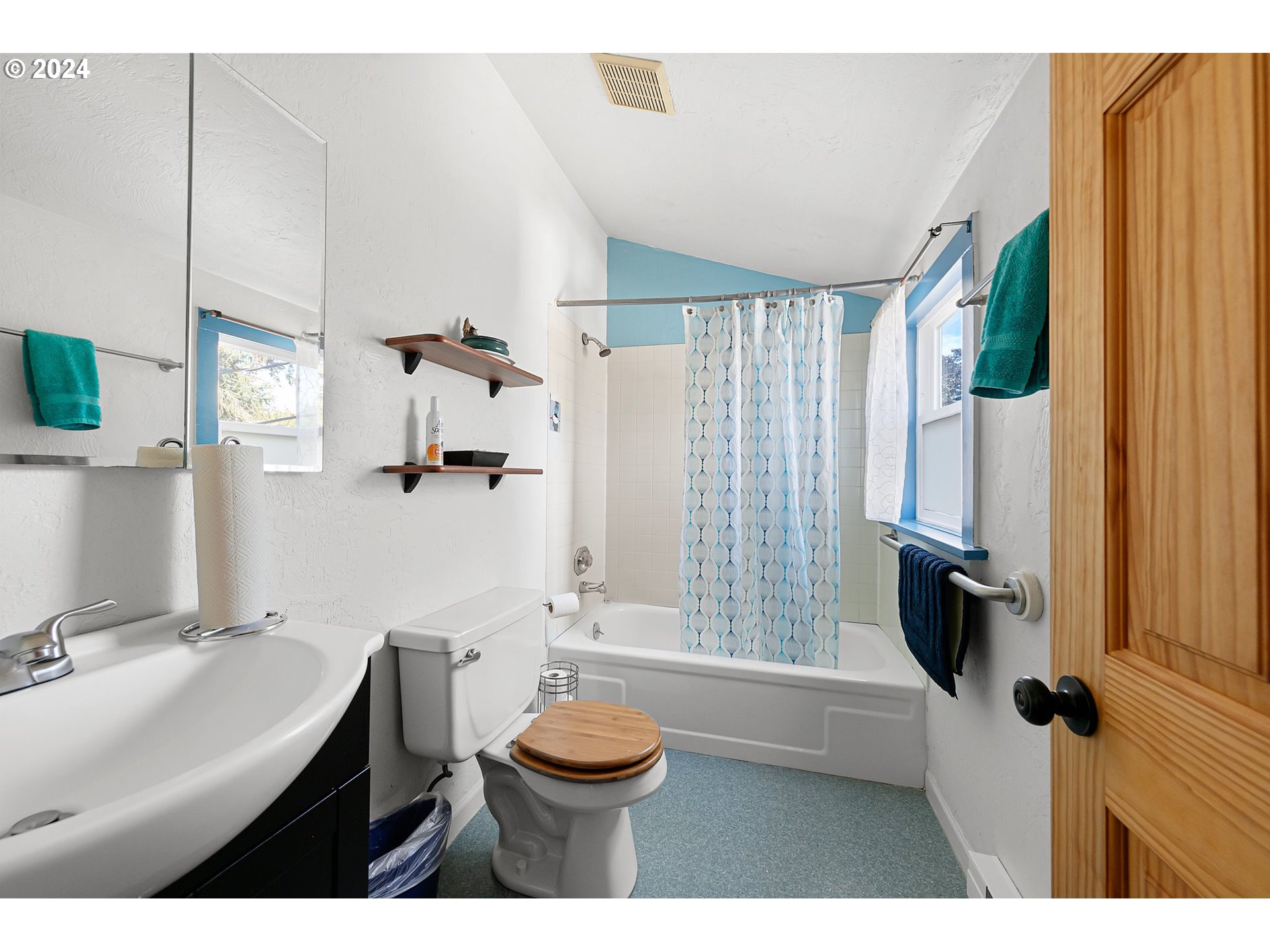 739 West 5th Avenue Eugene, OR 97402 - Photo 24 of 31 a bathroom with a sink a toilet a window and shower