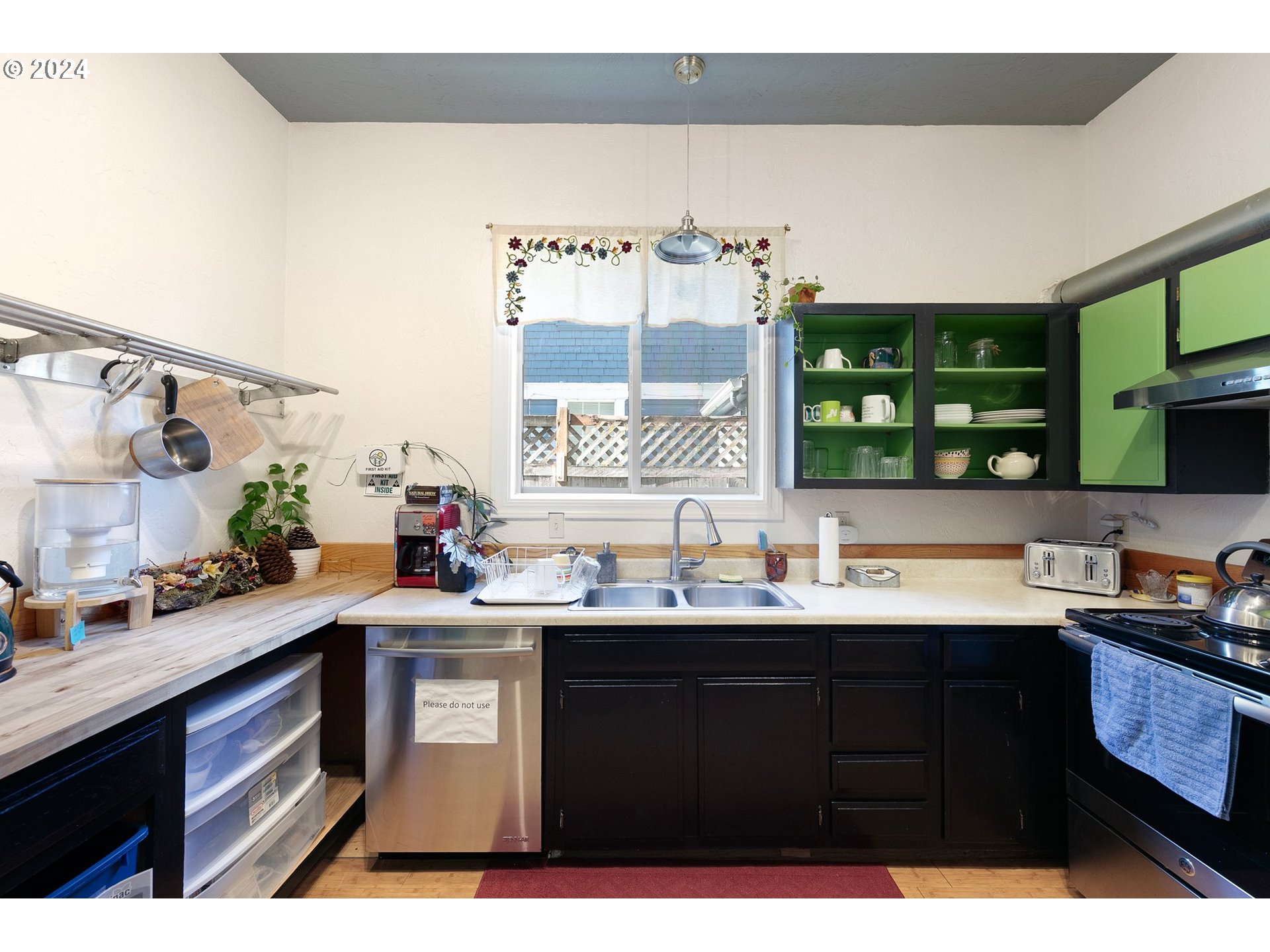 739 West 5th Avenue Eugene, OR 97402 - Photo 9 of 31 a kitchen with a sink and cabinets