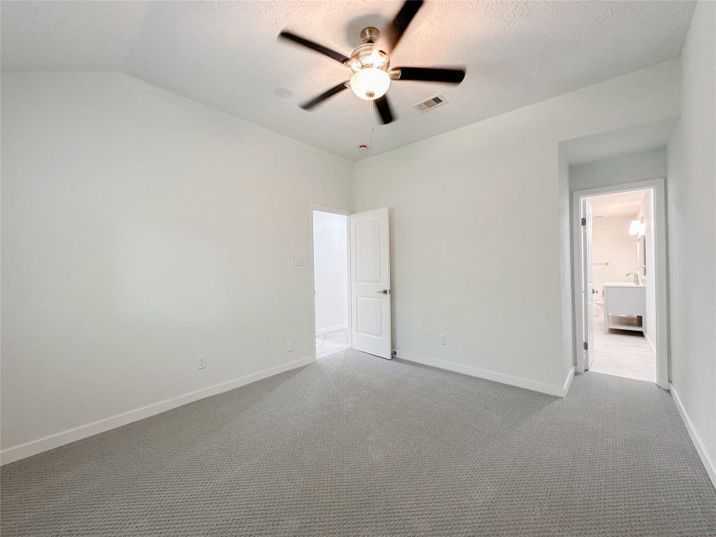 22103 Diane Drive Spring, TX 77373 - Photo 12 of 23 an empty room with closet and a ceiling fan