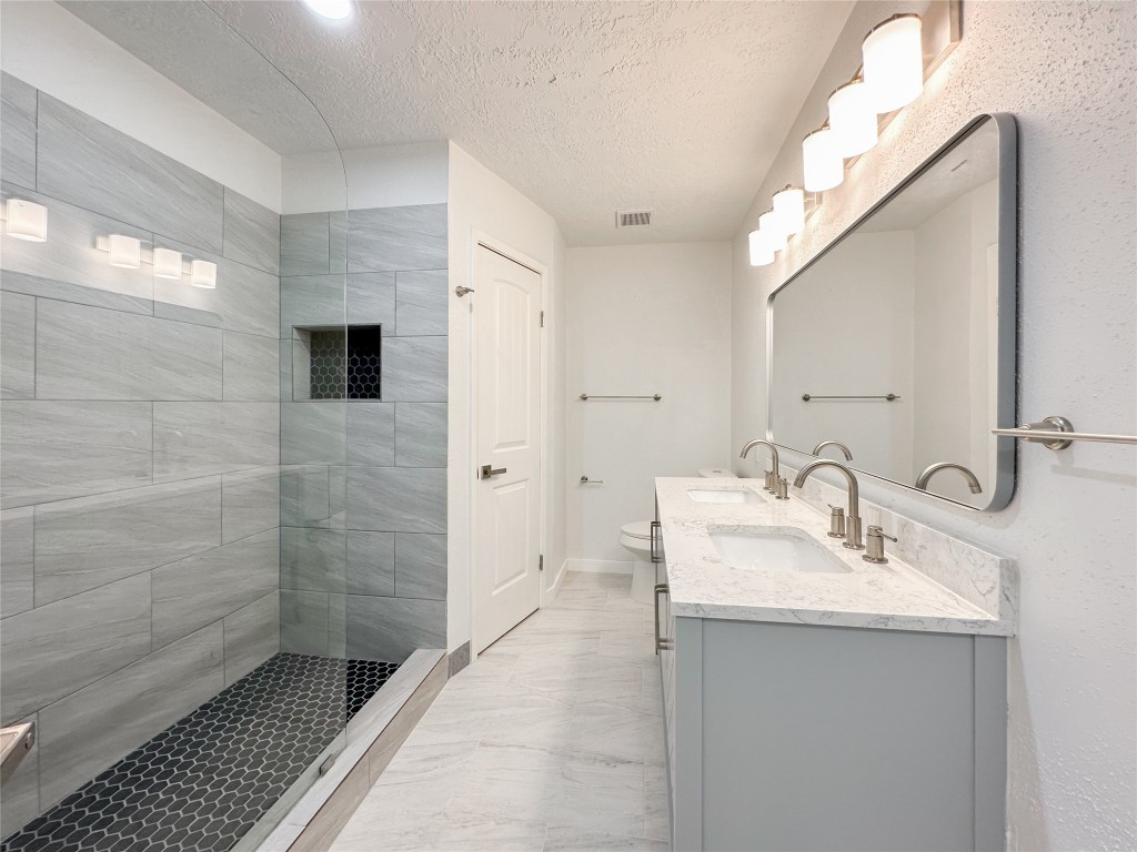 22103 Diane Drive Spring, TX 77373 - Photo 14 of 23 a bathroom with a sink a toilet and shower